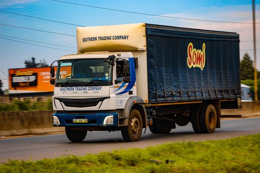 A Southern Trading Company truck drives along a highway in Mankayane, Eswatini.