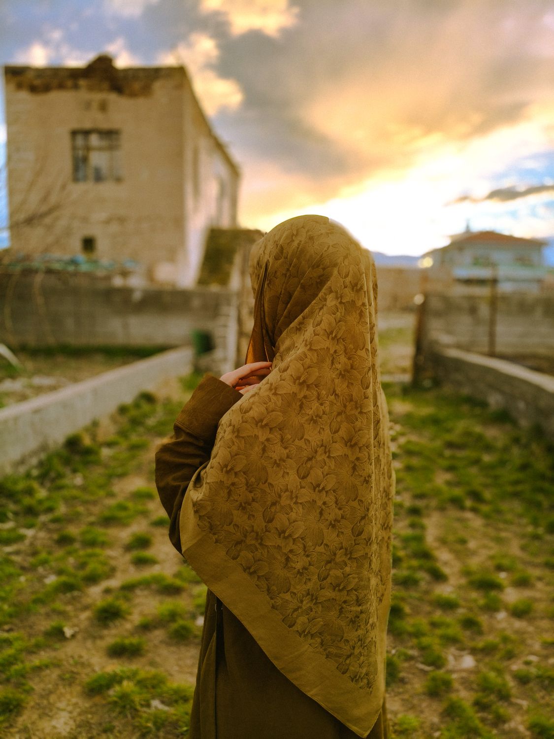 Woman in Hijab Gazing at Sunset in Rural Setting · Free Stock Photo