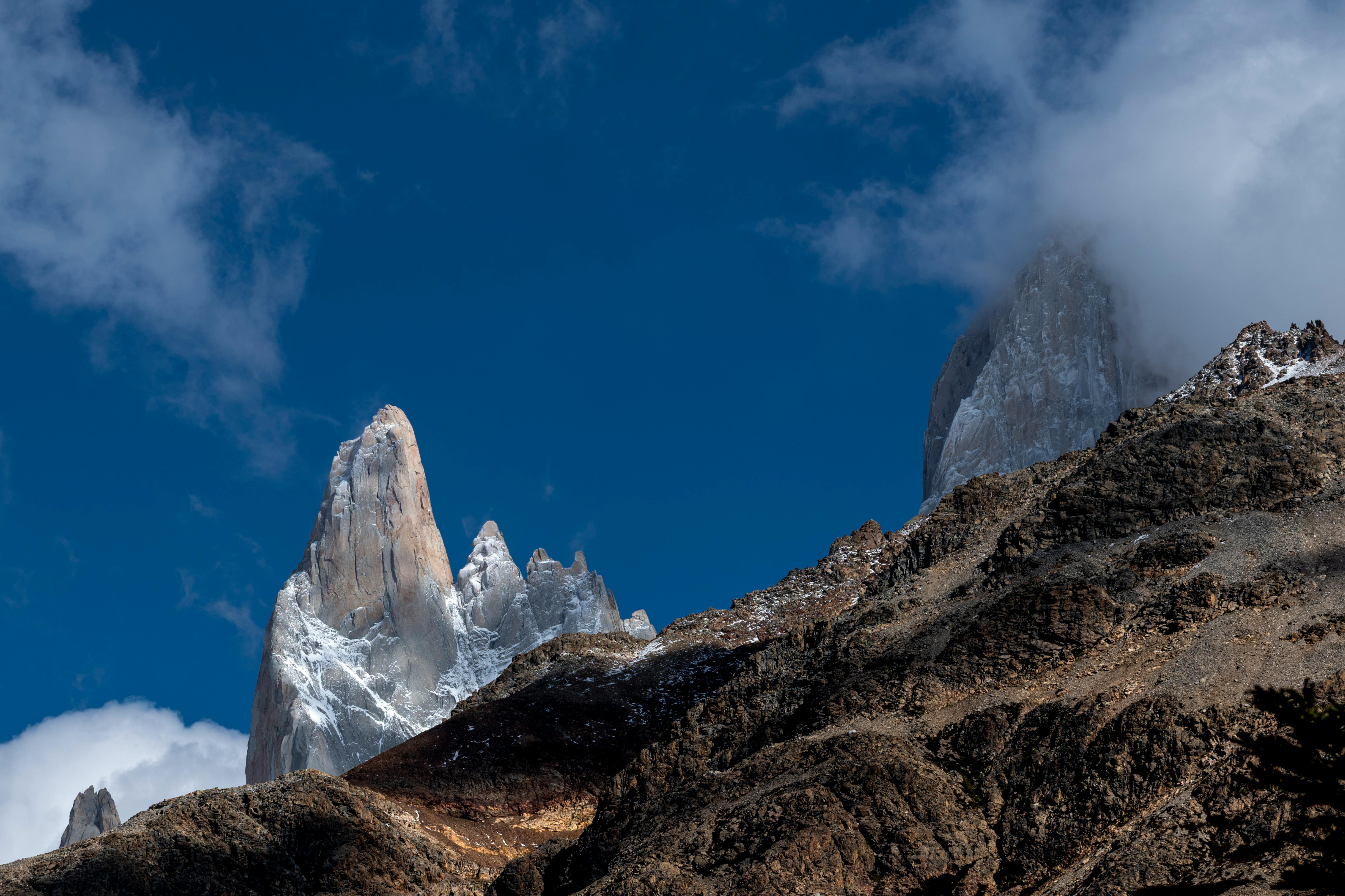 Stunning view of Mount Fitz Roy with clear blue skies and snow-capped peaks in Patagonia.
