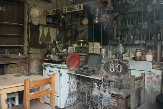 Explore a vintage store reflecting Argentina's rustic charm with antique items and wooden furniture.