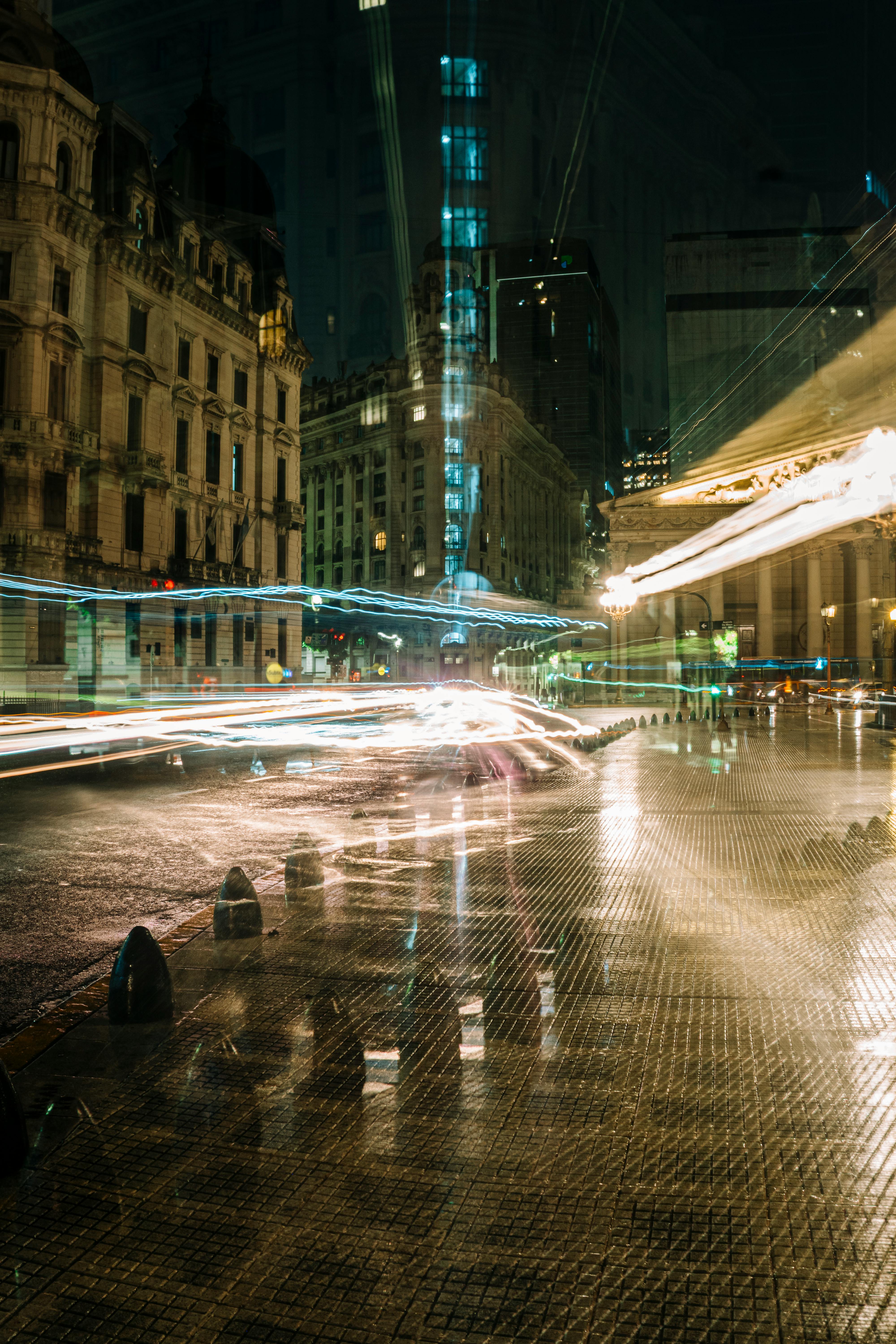 Dynamic long exposure of Plaza de Mayo in Buenos Aires showcasing city life at night.