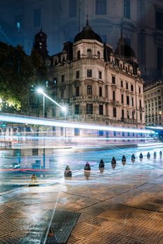 Long exposure of traffic passing historic building at night in Buenos Aires, Argentina.