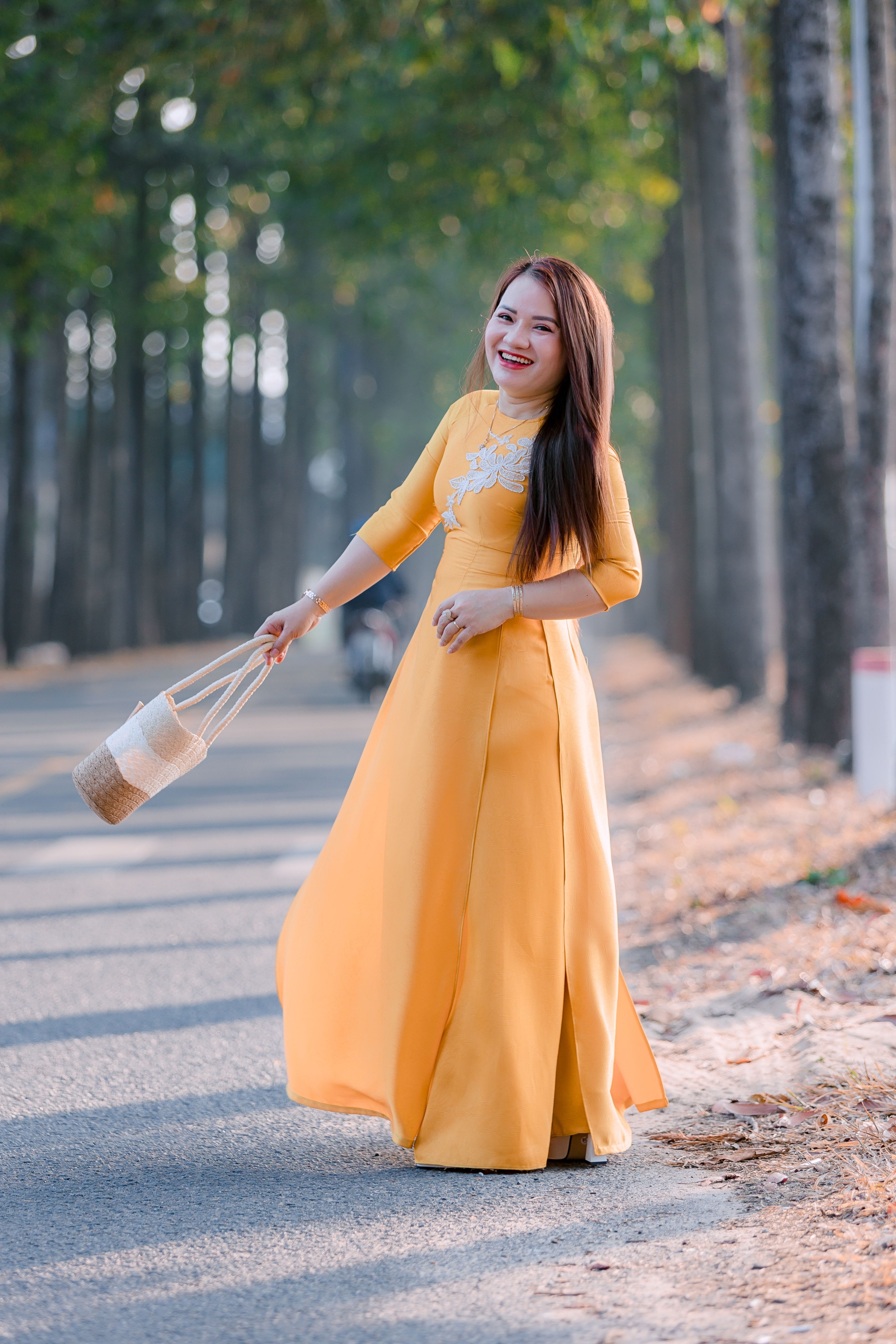 Woman in Yellow Traditional Dress in Autumn Setting · Free Stock Photo