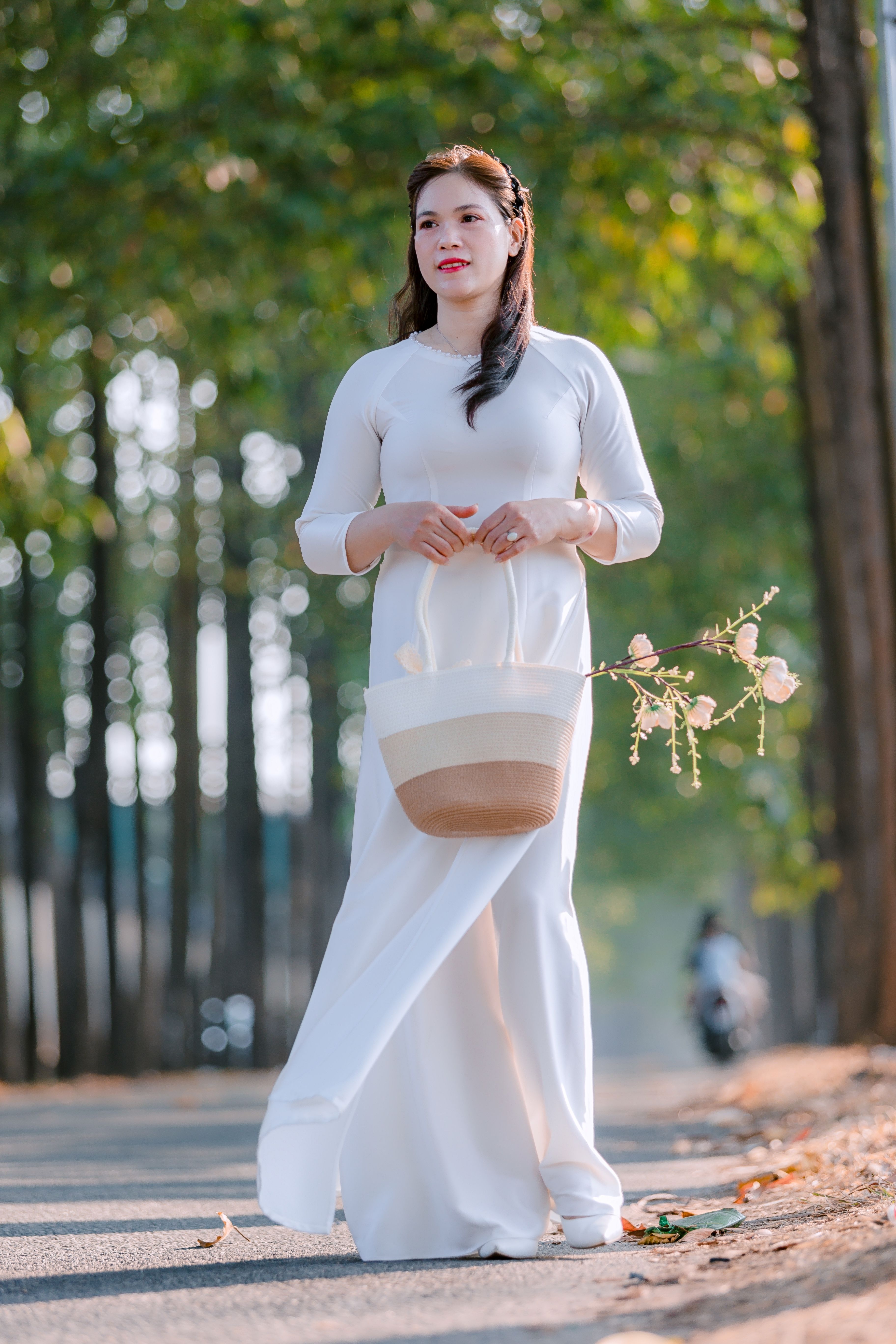 Woman in White Dress Strolling Through Park · Free Stock Photo