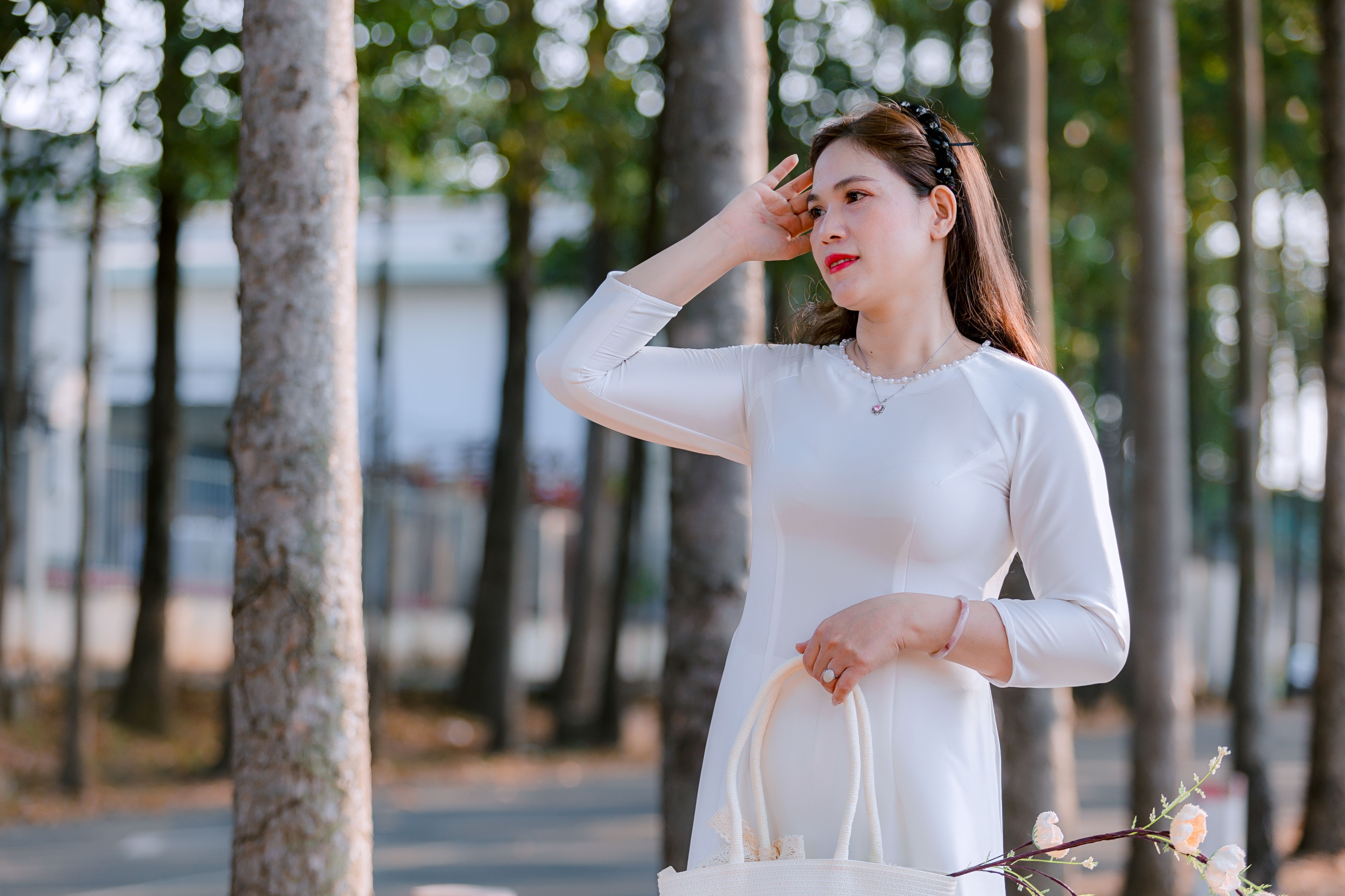 Woman in White Dress in a Forest Setting · Free Stock Photo