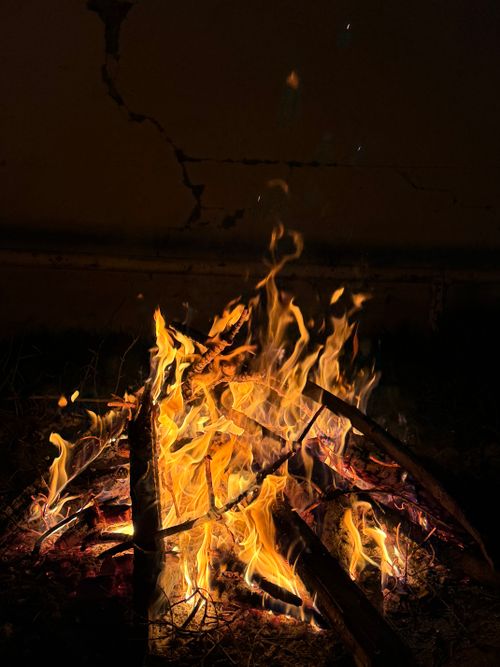 Free A vibrant campfire blazing against a night sky, set outdoors in Celilabad, Azerbaycan. Stock Photo