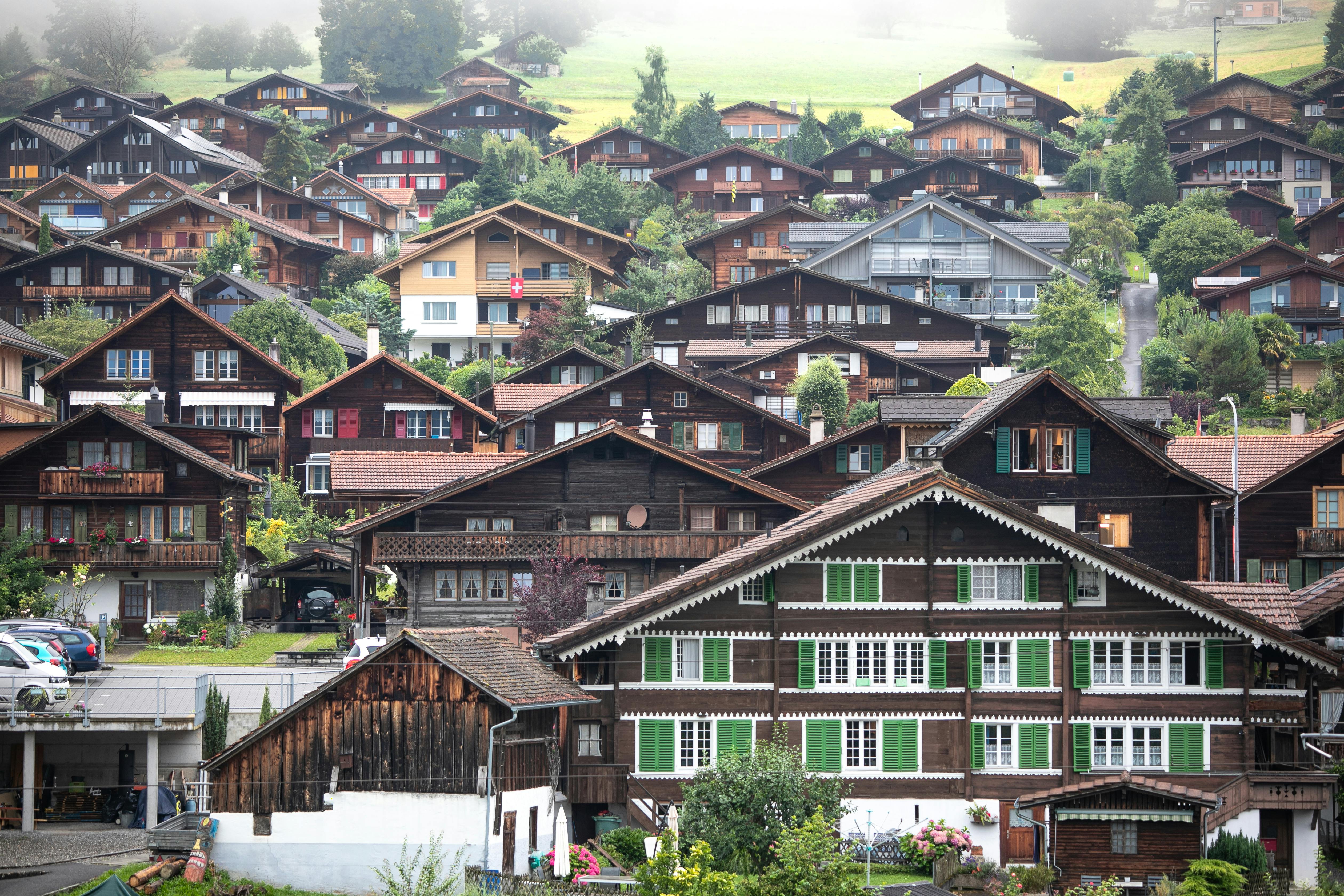 Scenic view of traditional Swiss chalets in the picturesque village of Interlaken, Switzerland.