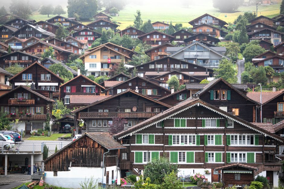 Scenic view of traditional Swiss chalets in the picturesque village of Interlaken, Switzerland.