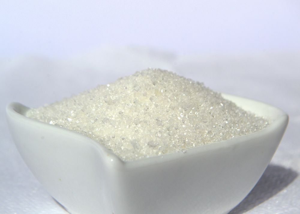 White sugar crystals in a bowl
