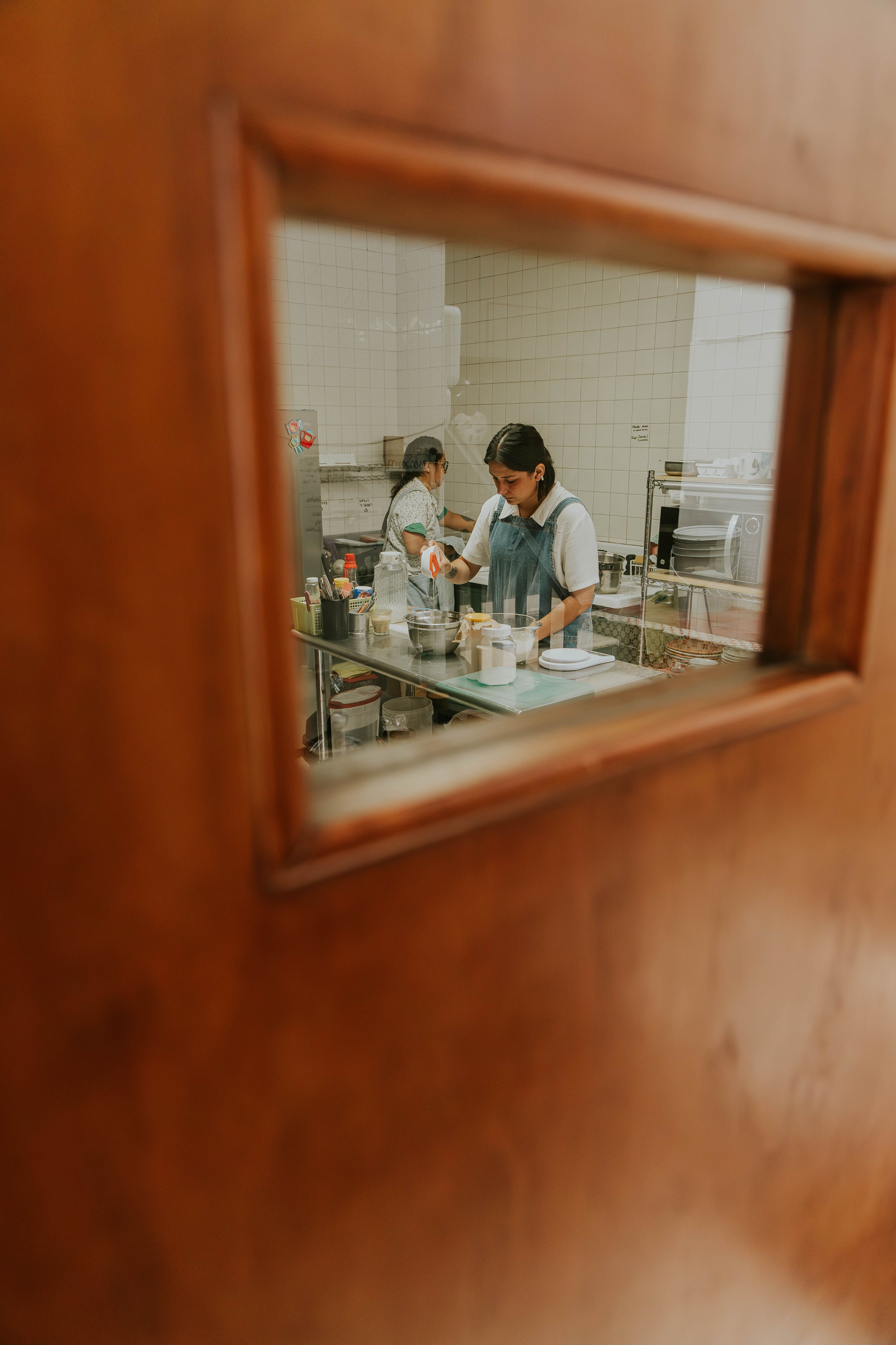 Operations lead with a tablet in a kitchen