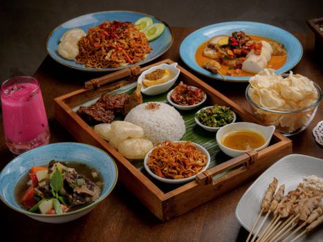 A delectable array of Indonesian dishes featuring nasi campur, satay, and spicy noodles.