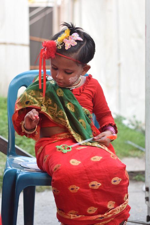 Free A child in colorful traditional clothing participates in a cultural festival in Dhaka, Bangladesh. Stock Photo