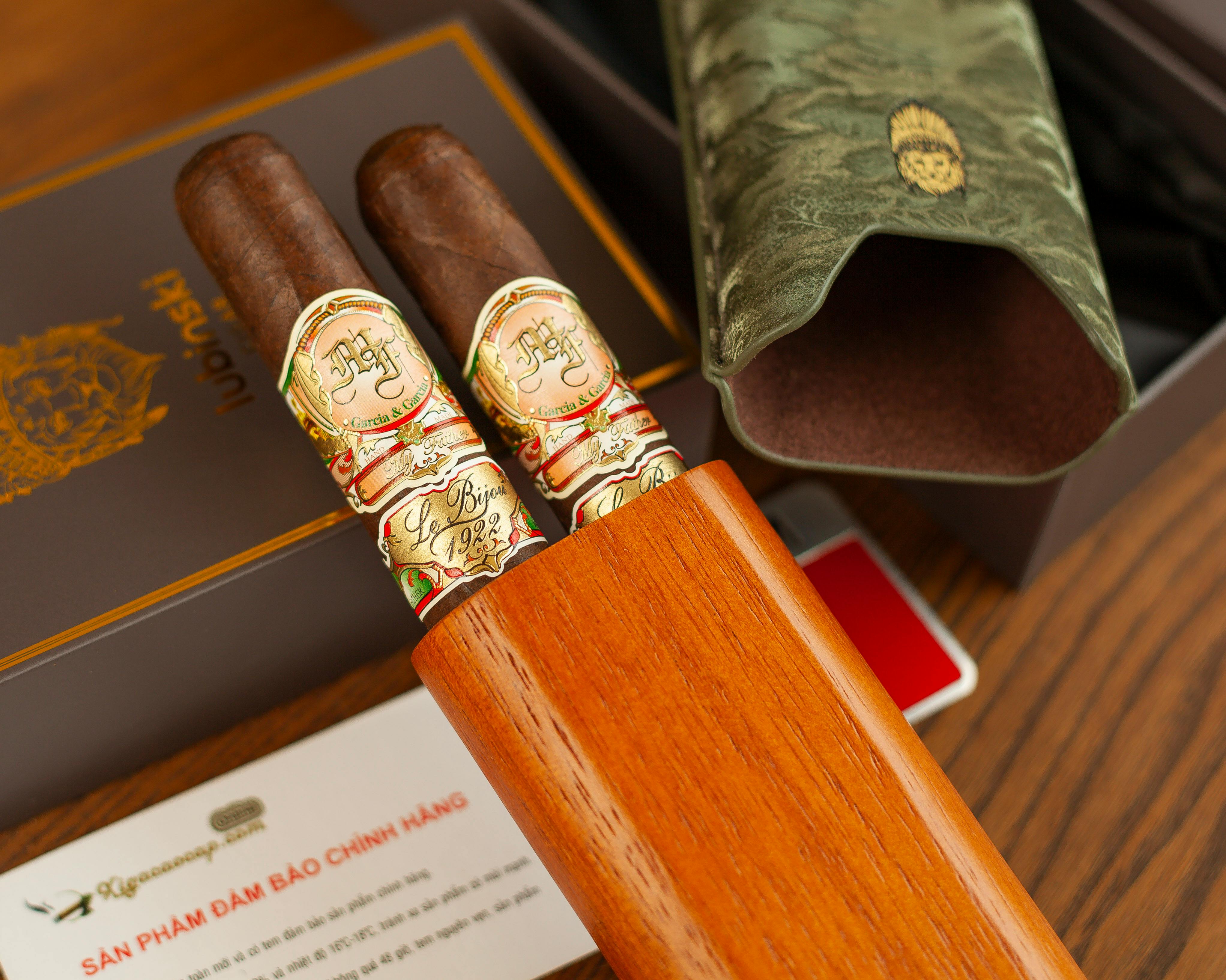 Close-up of premium cigars in a wooden box with elegant accessories, capturing a sense of luxury.