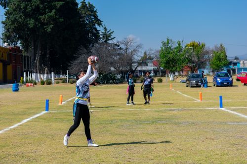 Free Action shot of youth playing flag football in Toluca de Lerdo, Mexico on a sunny day. Stock Photo