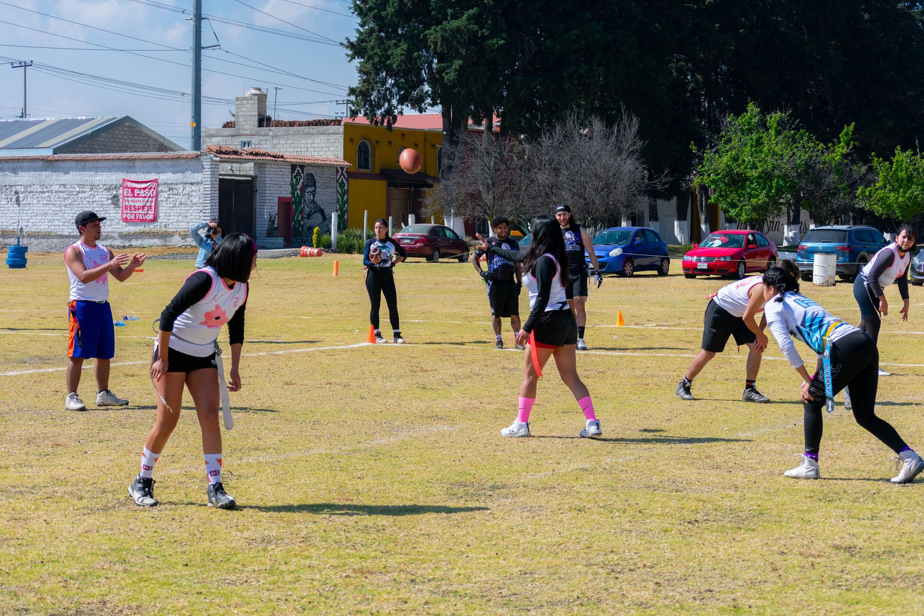 Exciting outdoor flag football game with youth players in Toluca de Lerdo, Mexico.