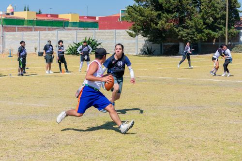 Free Action-packed youth football game on a sunny day in Toluca de Lerdo, Mexico. Stock Photo