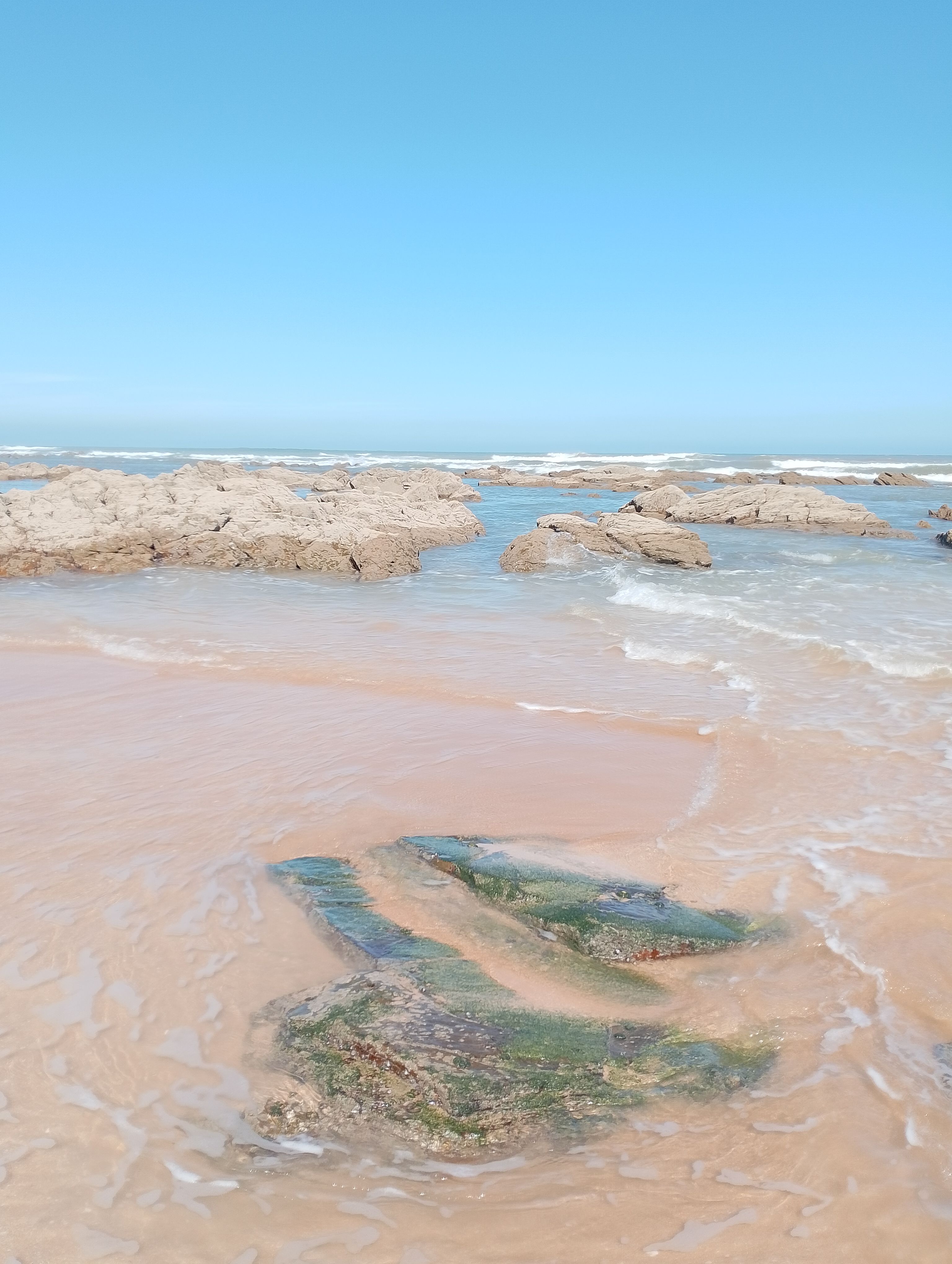 Scenic Coastal Beach with Rock Formations · Free Stock Photo