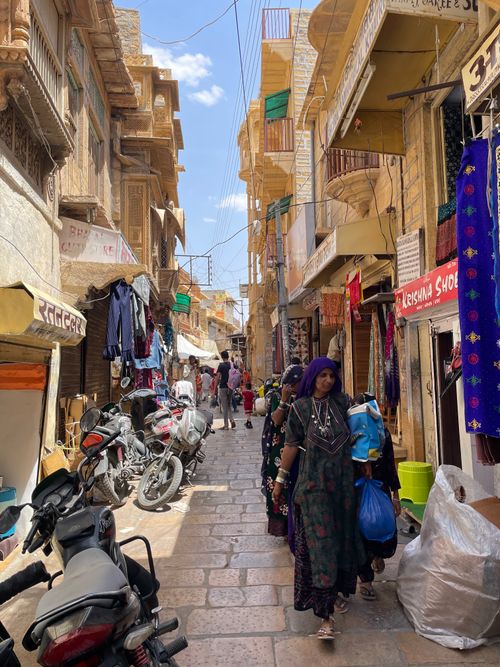 Free Colorful market street in Jaisalmer, India with local shoppers. Experience the vibrant culture. Stock Photo