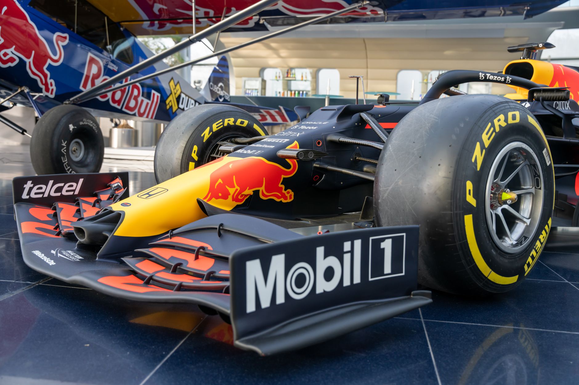 Close-up of a Red Bull Racing Formula 1 car displayed indoors in Salzburg, Austria.