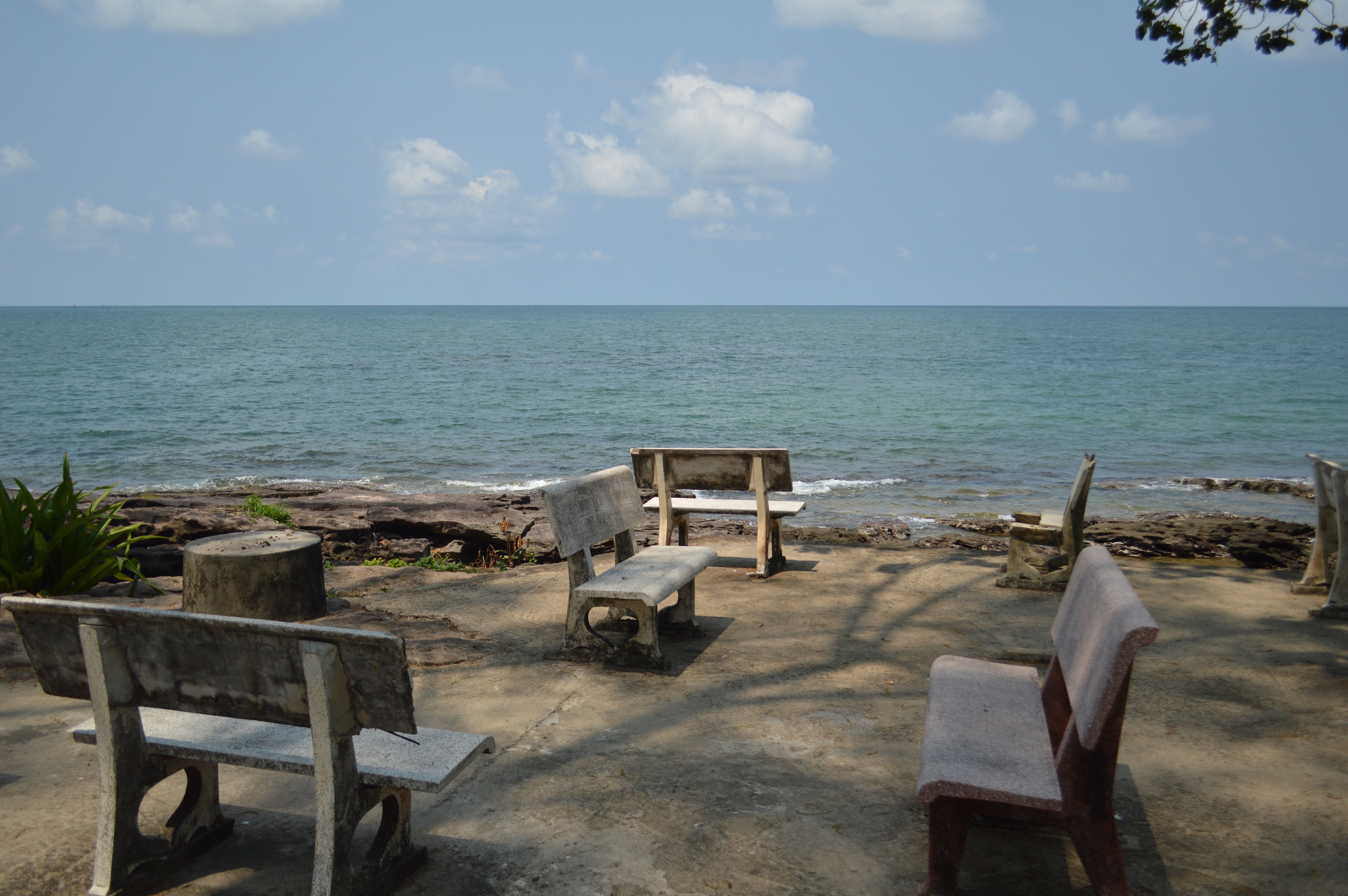 Tranquil Seaside Benches Overlooking Ocean View · Free Stock Photo