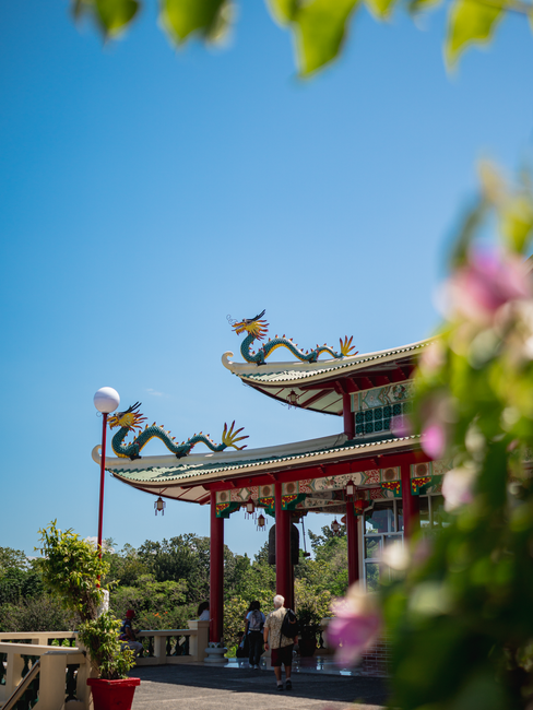 Traditional temple with dragon sculptures under a clear blue sky in Central Visayas.