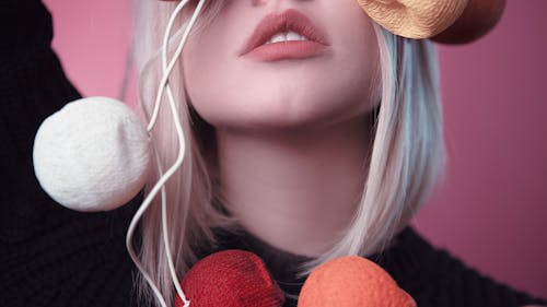 Woman Holding Knitted Ball Decor