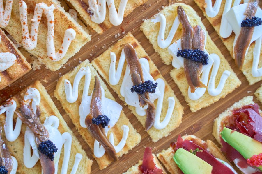 Anchovy pintxos with caviar on toasts