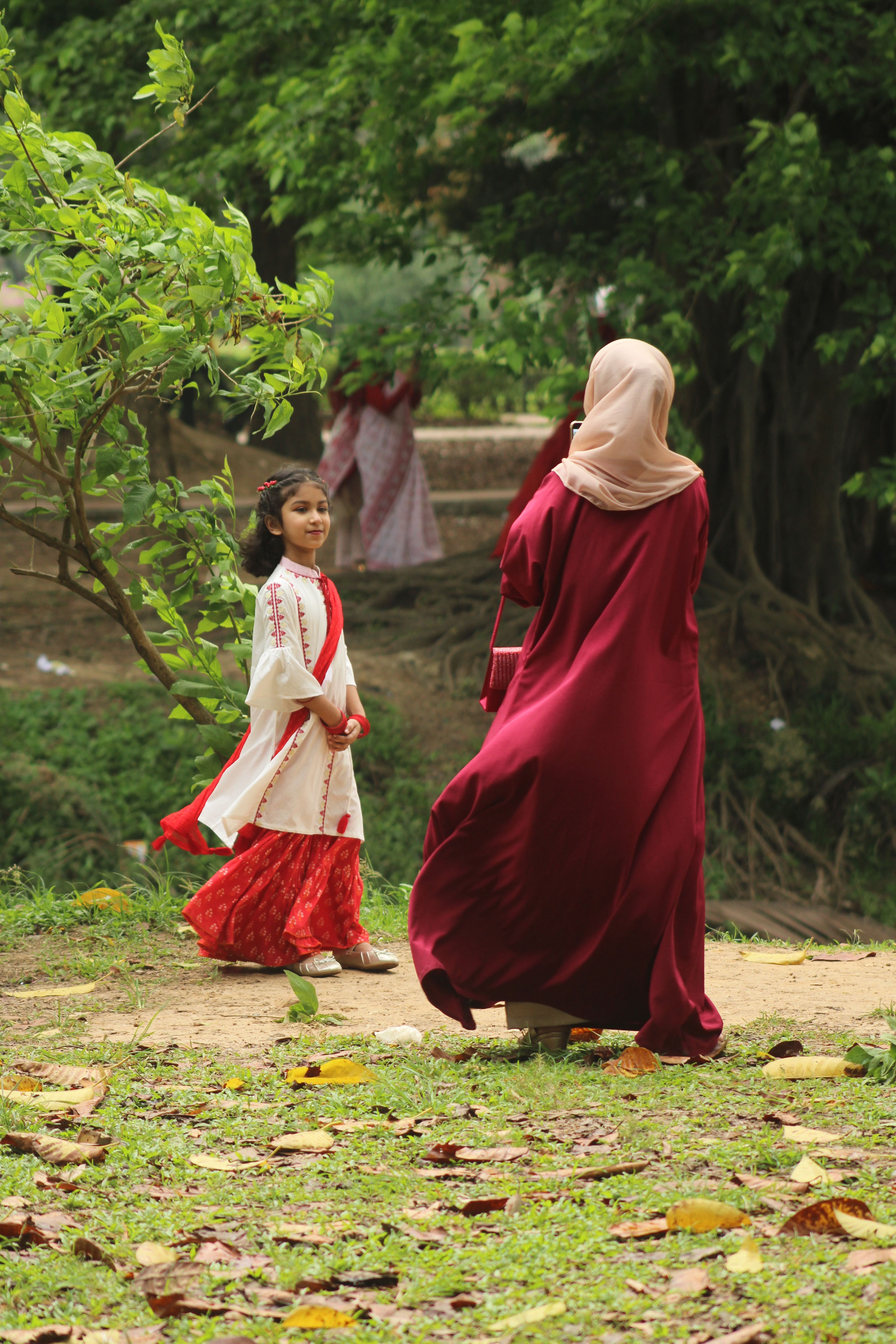 Mother and Daughter Enjoying a Walk in the Park · Free Stock Photo