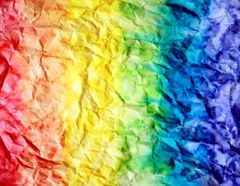 Rainbow gradient across crumpled paper — photo by Alexander Grey on Pexels