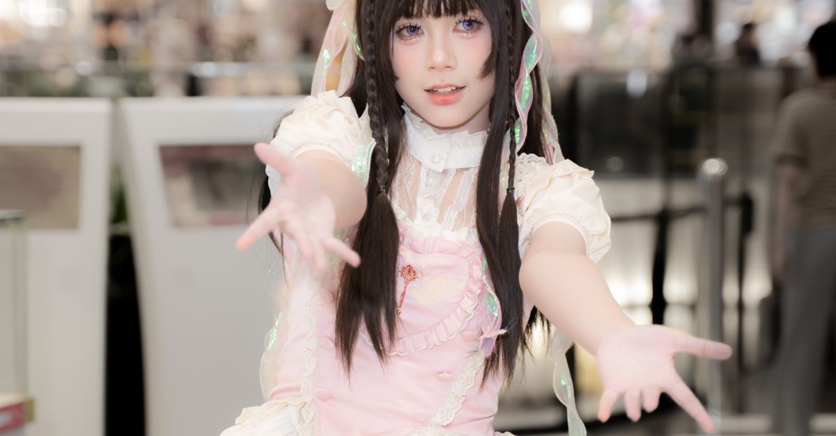 Cosplayer in Cute Lolita Fashion Outfit Indoors · Free Stock Photo
