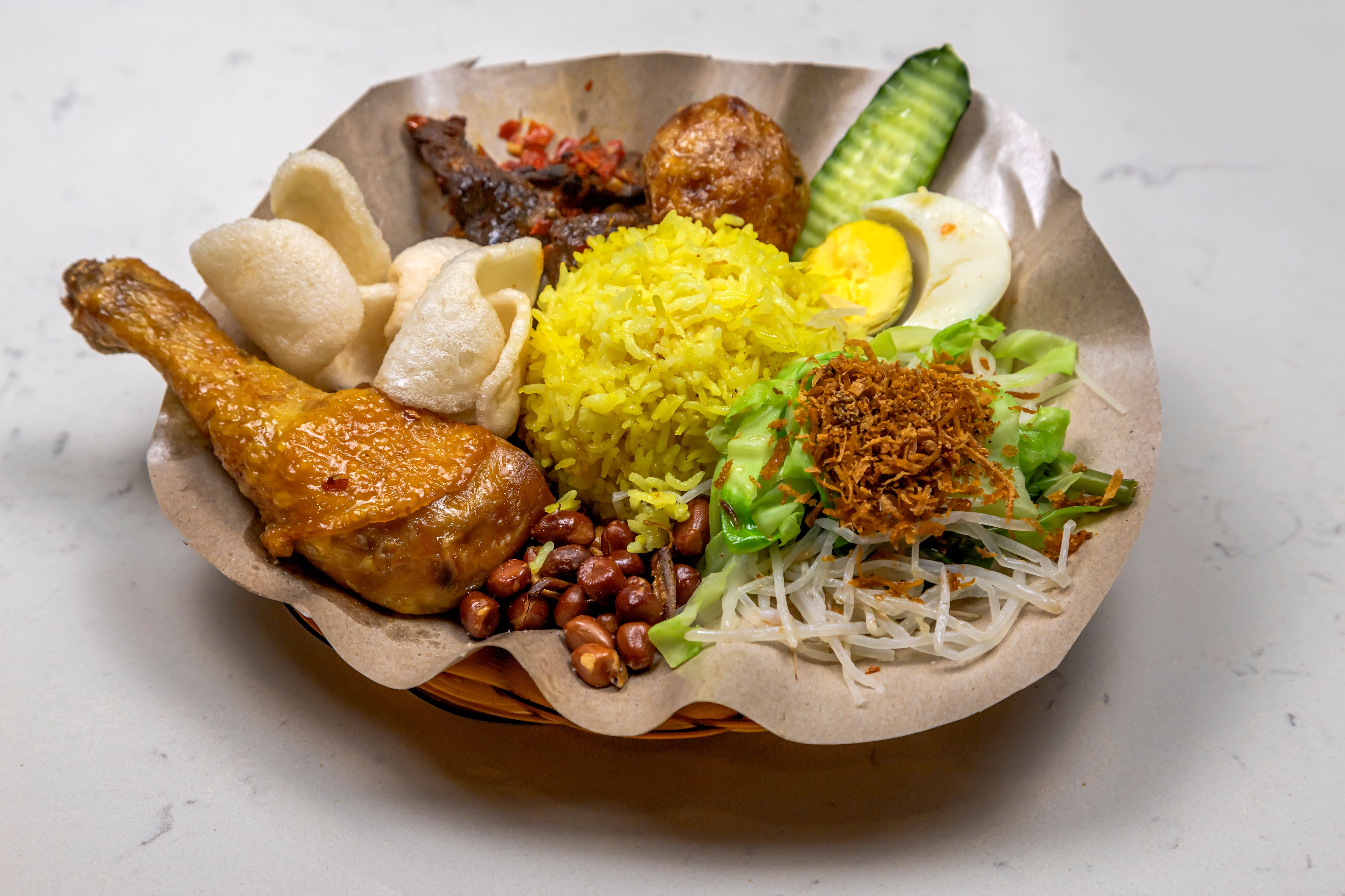 Yellow-colored rice version of Nasi Kerabu | Man Fong Wong/Pexels