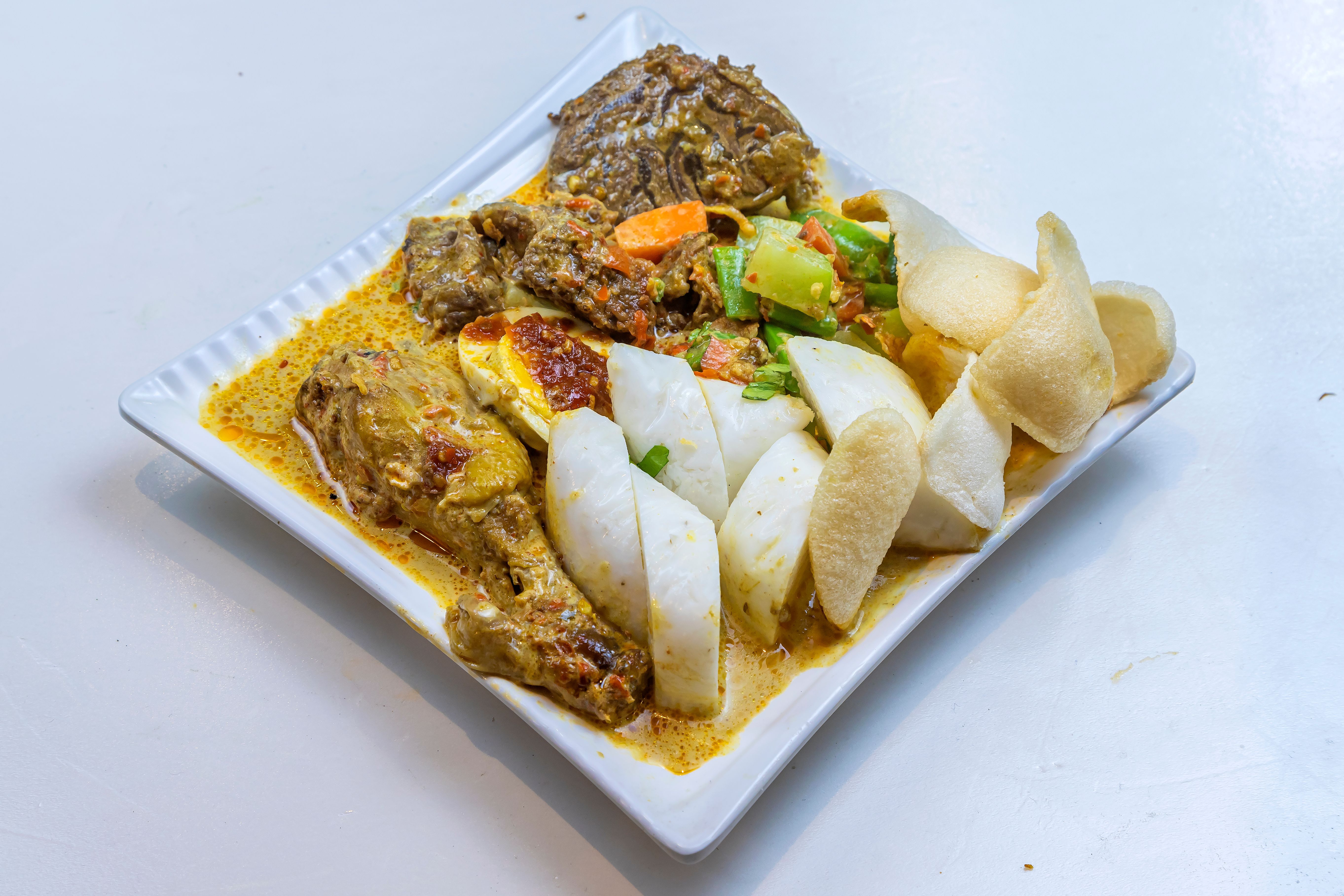 Fragrant Green Curry in Crispy Onions