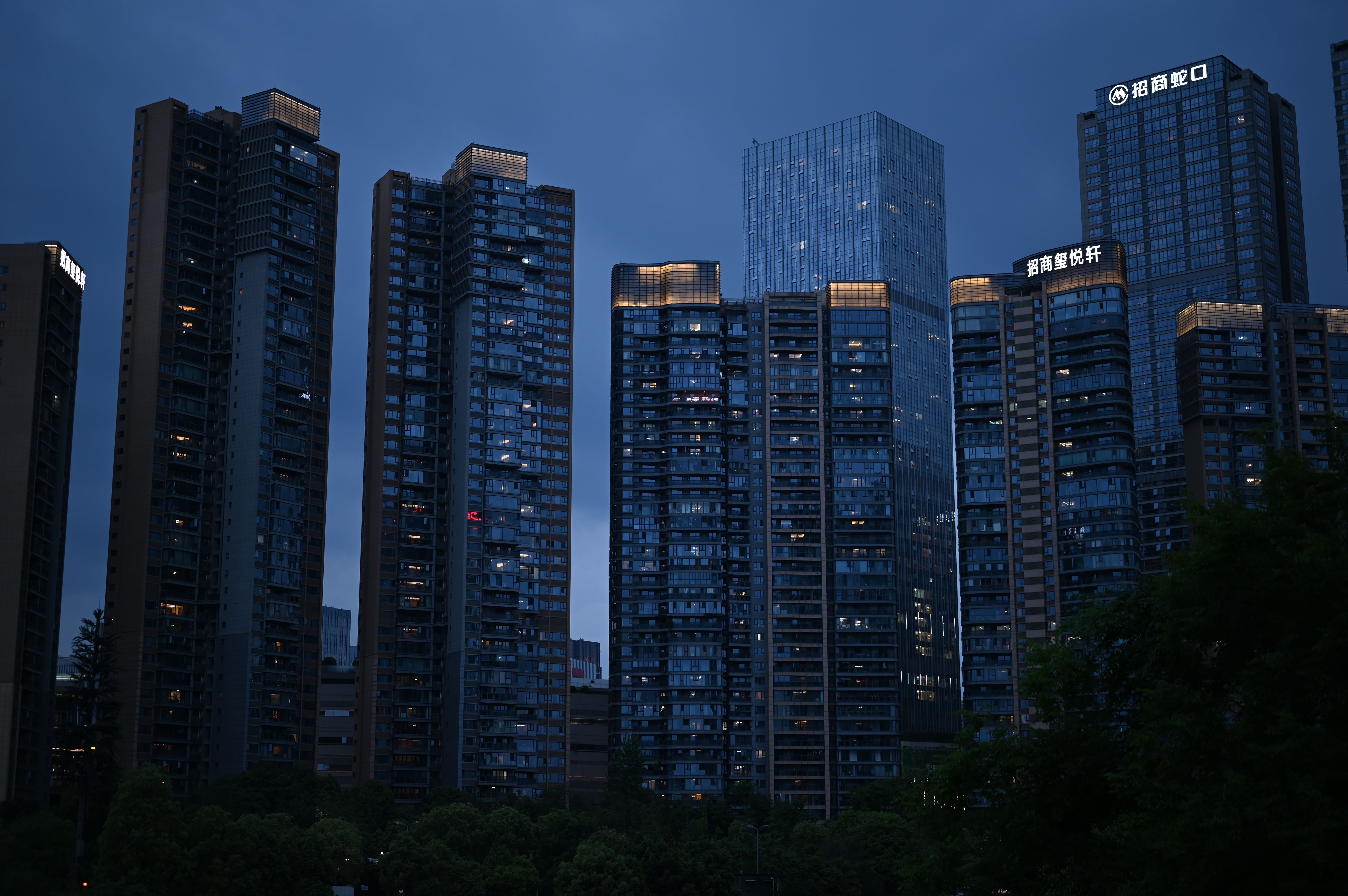 High-rise Buildings at Night in Urban Skyline · Free Stock Photo