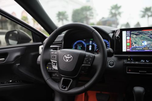 Free Interior view of a modern car showcasing the steering wheel, dashboard, and GPS display screen. Stock Photo