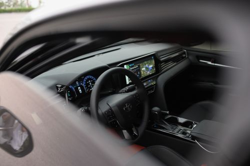 Free Close-up view of a modern car interior highlighting the sleek dashboard and digital display. Stock Photo