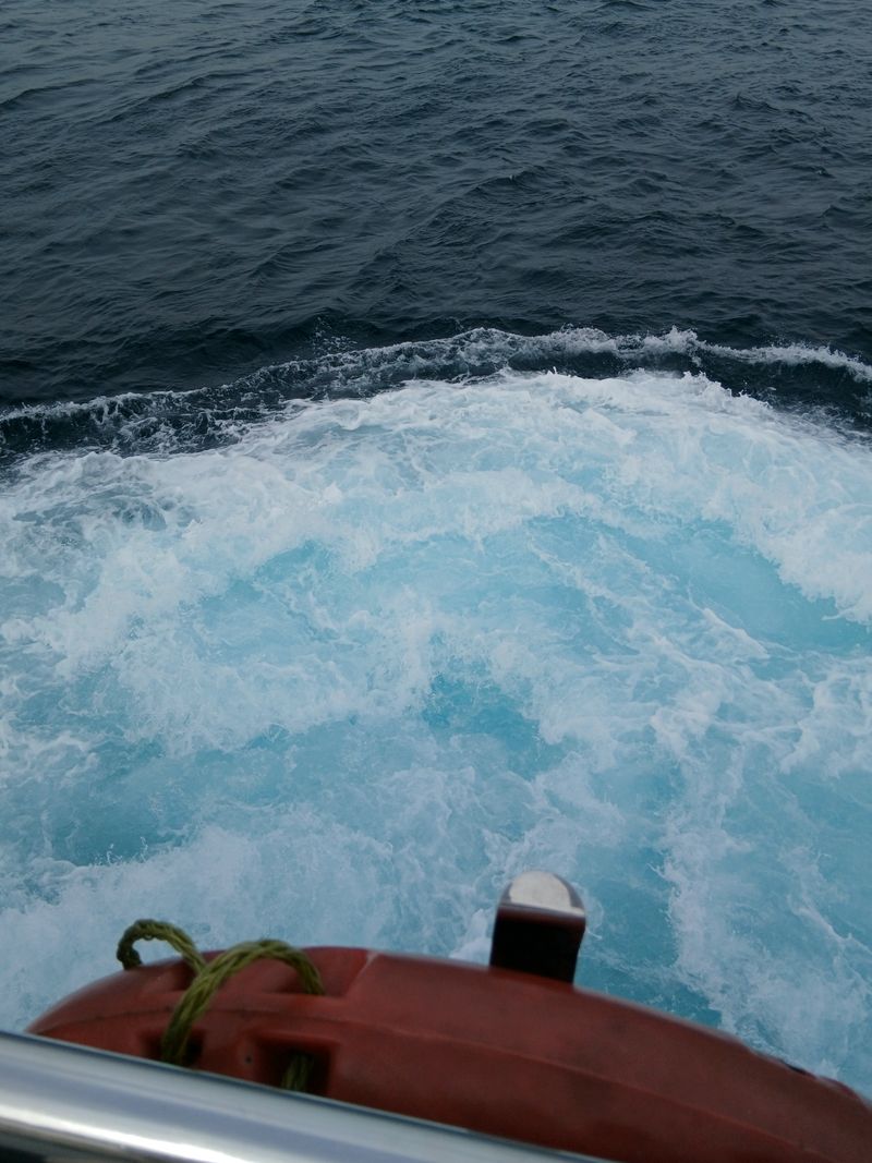 Foamy ocean waves seen from a boat, photo by Melike on Pexels