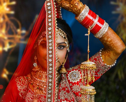 Woman in Red and Gold Sari Dress