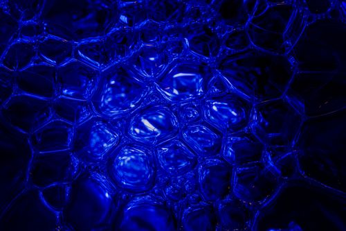 Free Close-up of intricate blue bubbles creating a mesmerizing abstract pattern. Stock Photo