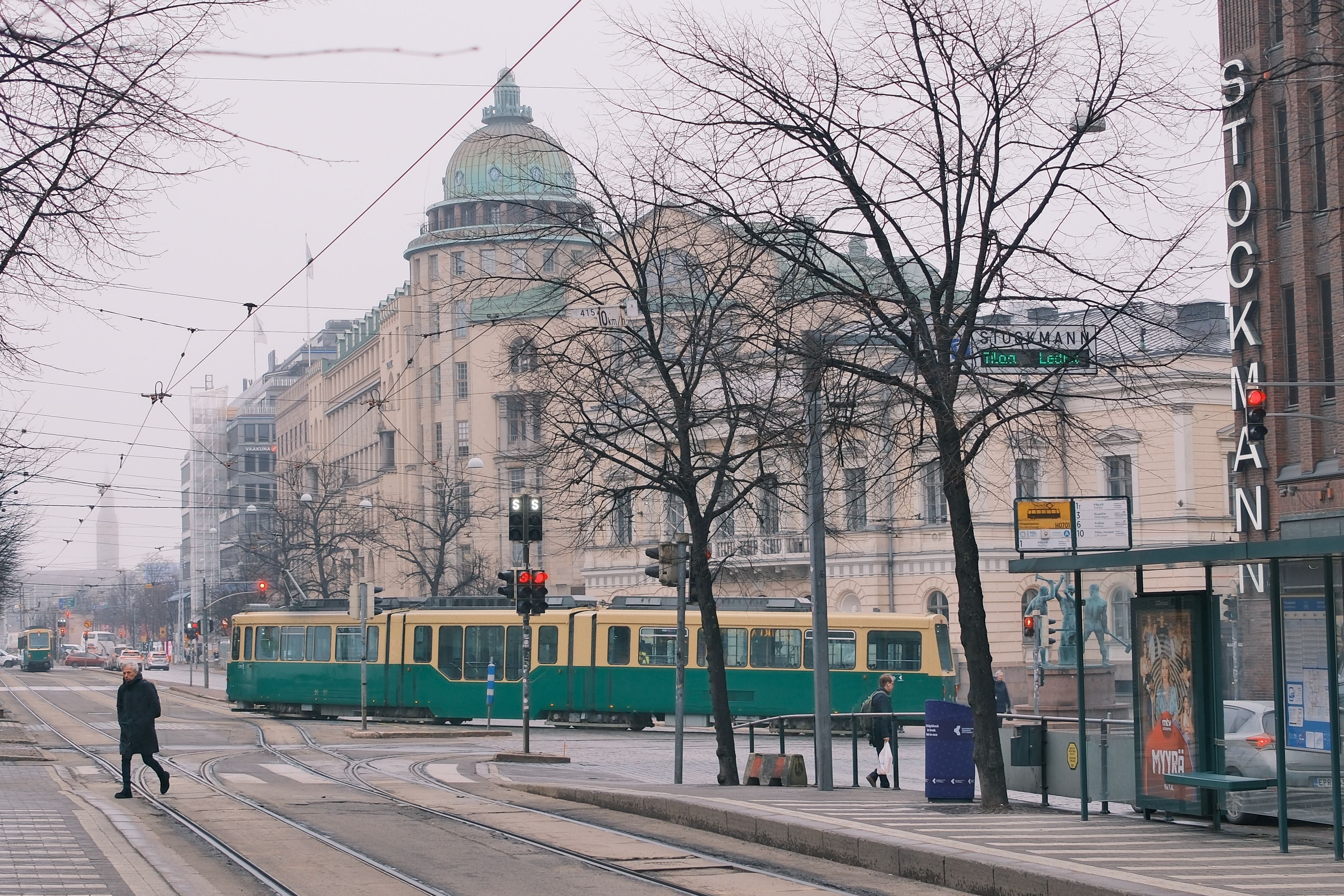 Street Scene with Tram and Stockmann Sign in Helsinki · Free Stock Photo