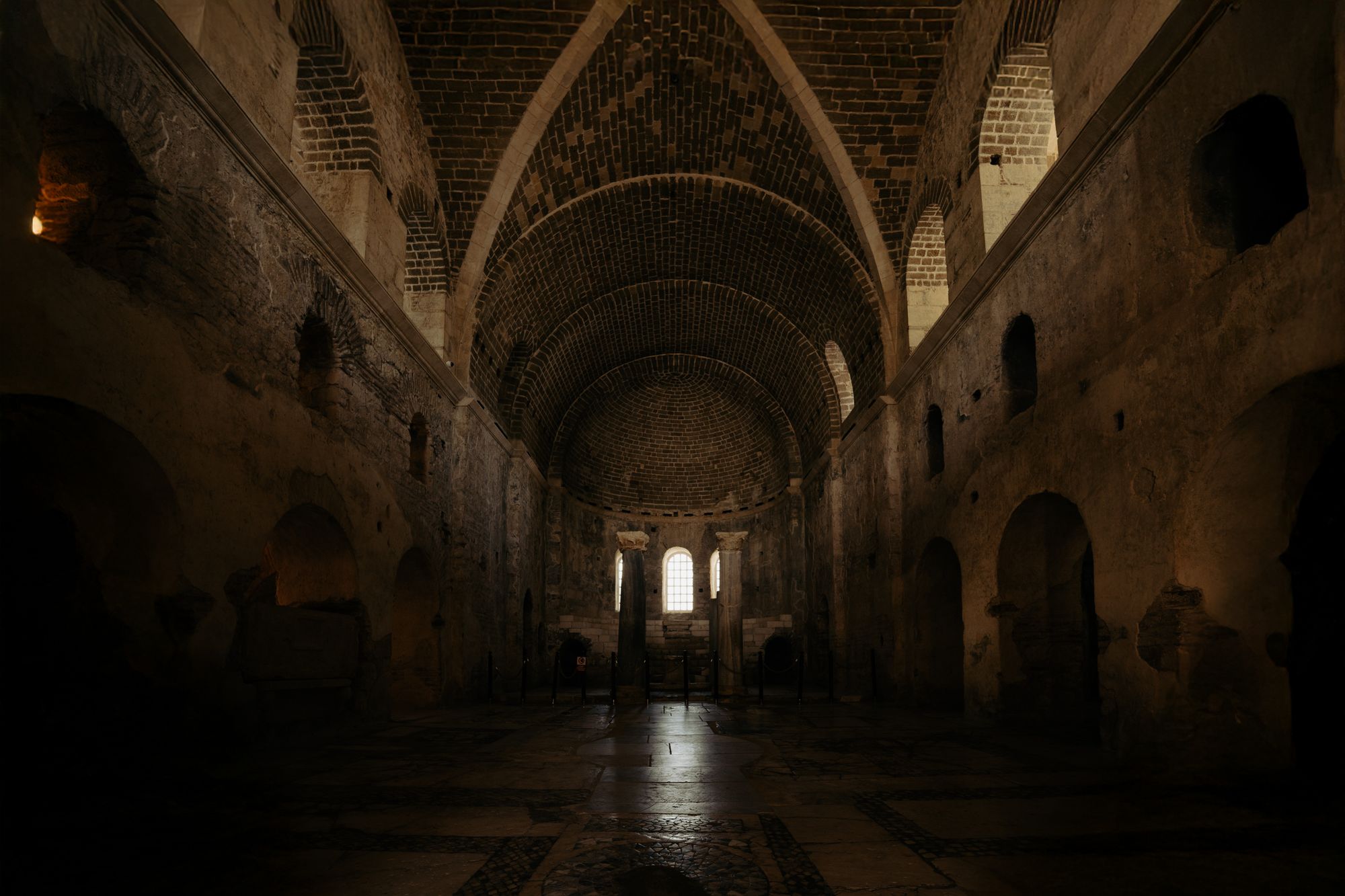 Dark interior of an ancient cathedral — photo by metehan demir on Pexels
