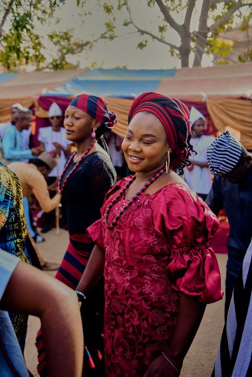 Free Joyful African celebration showcasing vibrant traditional attire and cultural unity. Stock Photo