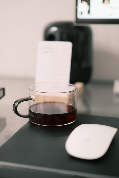 Minimalist Workspace with Coffee and Computer · Free Stock Photo