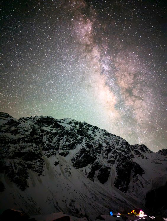 Starry Night Sky Over Snowy Mountain Range · Free Stock Photo
