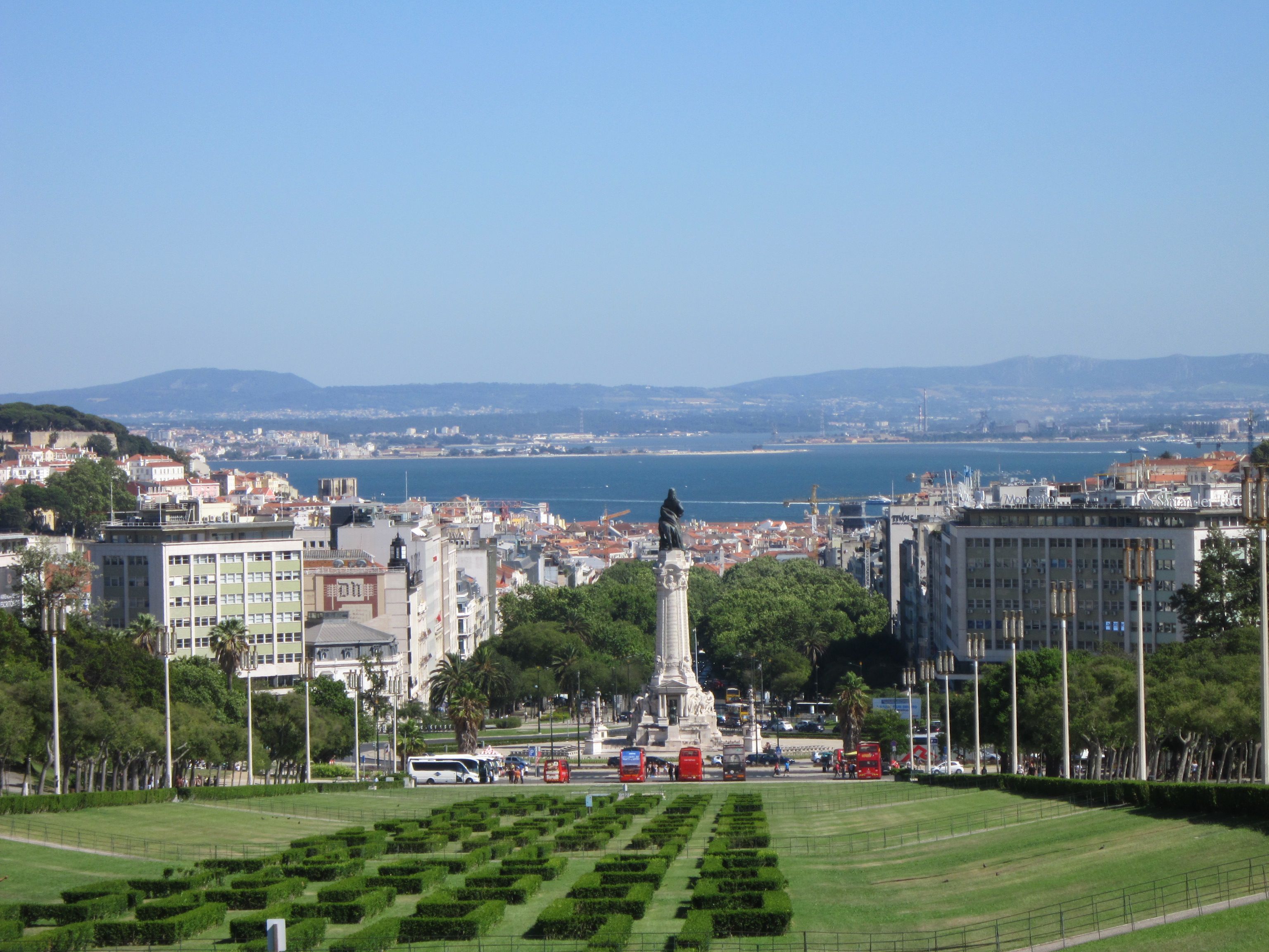 Scenic view of Lisbon cityscape and the Tagus River from Eduardo VII Park in summer.