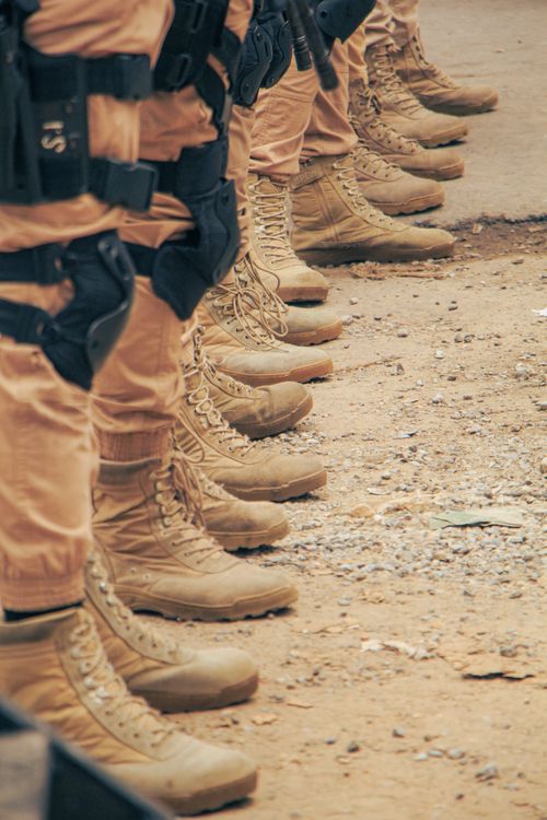 Free Close-up of military boots in row, symbolizing discipline and order. Stock Photo