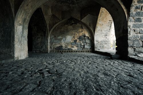 Free A stunning view of ancient stone arches inside a historic fort in Hyderabad, India. Stock Photo