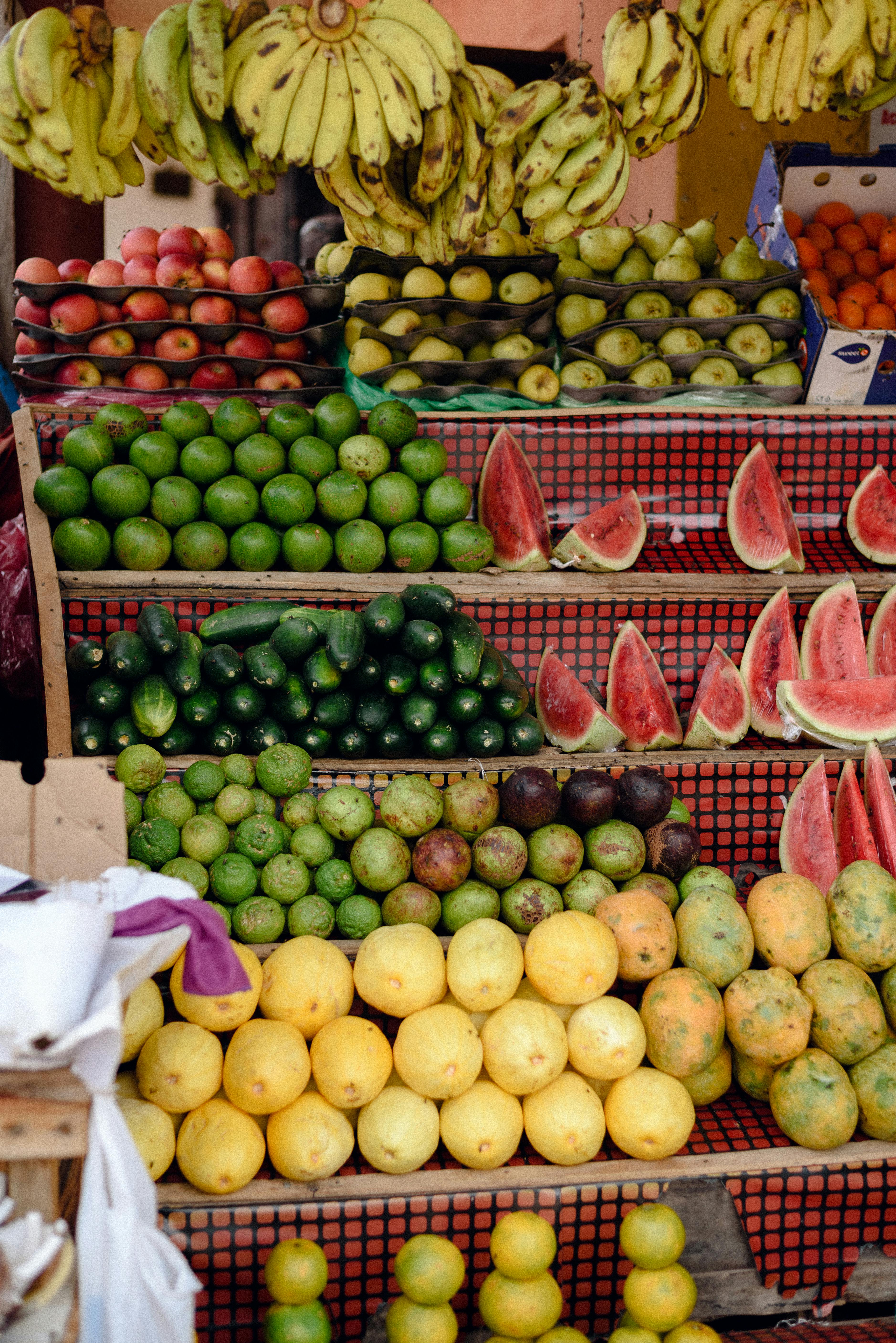 Fresh assortment of fruits displayed at a market stall in Jos, Nigeria, showcasing rich colors and variety.