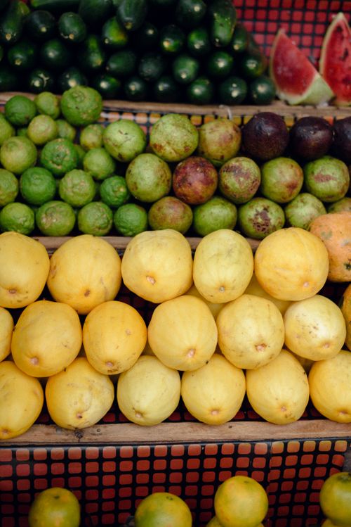 Free Colorful display of fresh fruits including lemons and limes at Jos, Nigeria market. Stock Photo