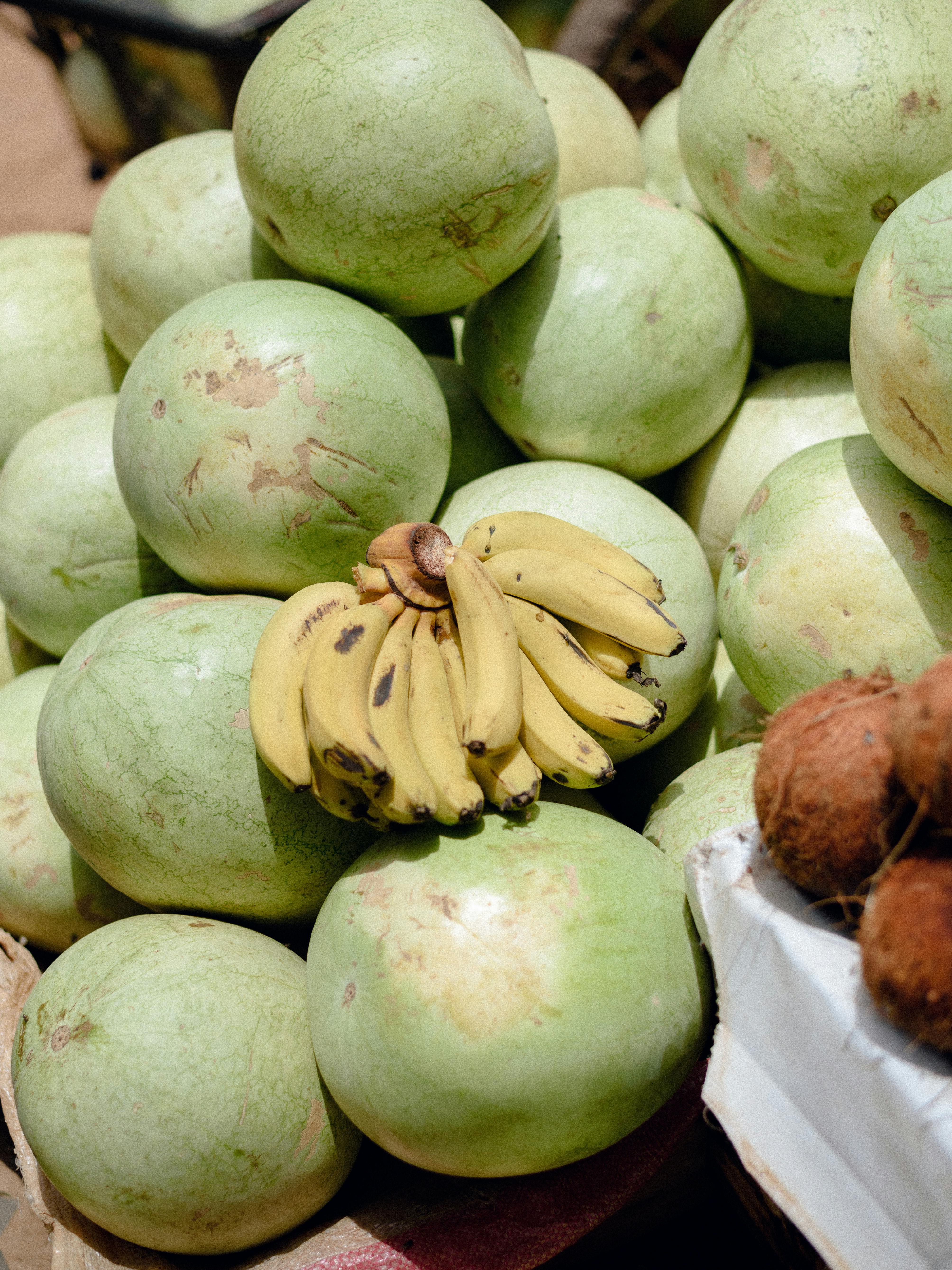 A vibrant assortment of watermelons and bananas on display at a market in Jos, Nigeria.
