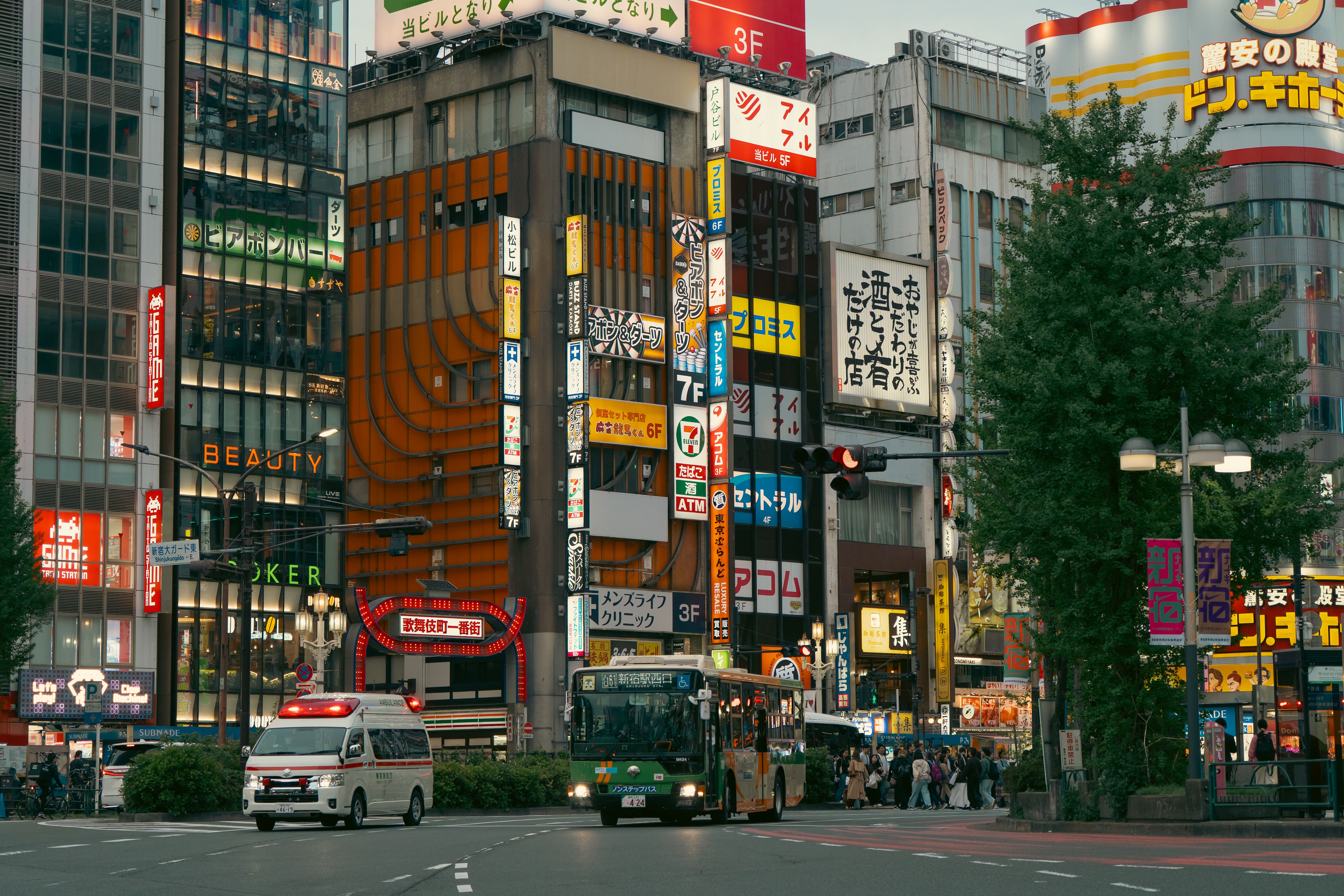 Vibrant Tokyo Street with Neon Signs and Traffic · Free Stock Photo